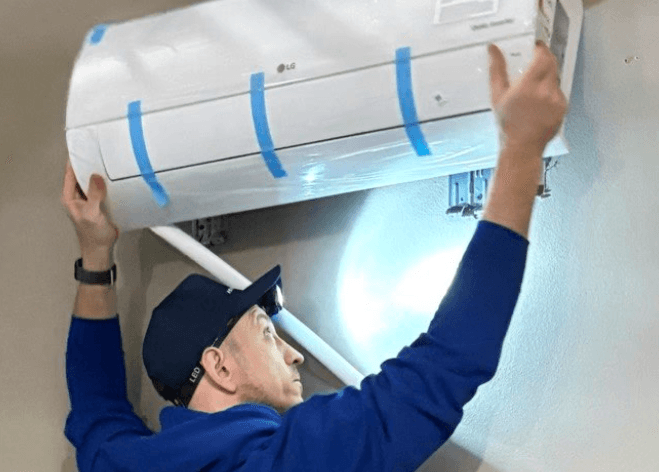 Mounting a new ductless mini-split indoor head onto its wall bracket